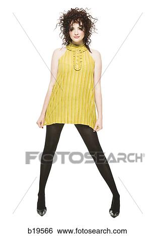 woman in a yellow dress View Large Photo Image Stock Photograph - woman in a yellow dress. Fotosearch