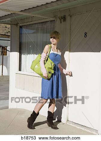 woman in front of a motel room. View Large Photo Image Stock Image - woman in front of a motel room.. Fotosearch