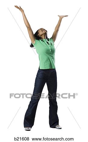 woman in green shirt with arms outstretched View Large Photo Image Stock Photo - woman in green shirt with arms outstretched. Fotosearch