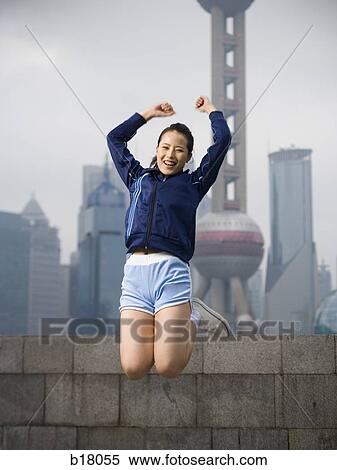 Woman jumping in the air. View Large Photo Image Stock Photography - Woman jumping in the air.. Fotosearch