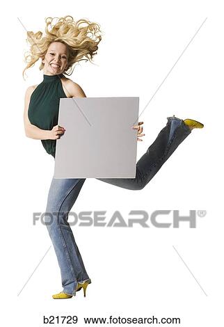 woman jumping with sign View Large Photo Image Stock Photo - woman jumping with sign. Fotosearch