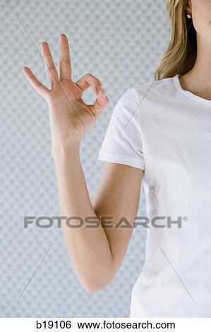 "Woman making ""ok"" sign with her hand. " View Large Photo Image Stock Photograph - "Woman making ""ok"" sign with her hand. ". Fotosearch