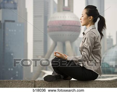 Stock Photograph - Woman meditating.. Fotosearch