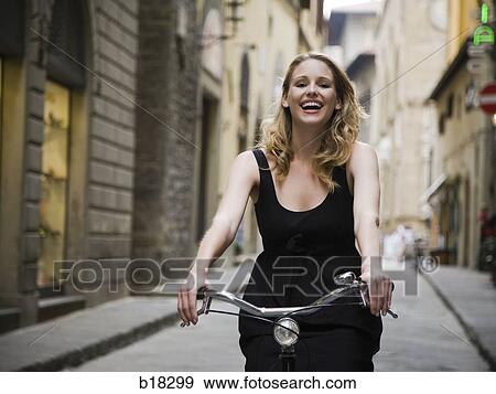 Woman on a bicycle. View Large Photo Image Stock Photo - Woman on a bicycle.. Fotosearch