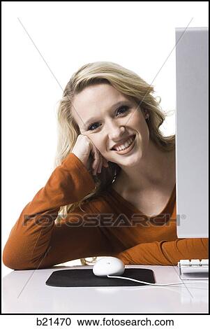 Stock Image - woman on a computer. Fotosearch