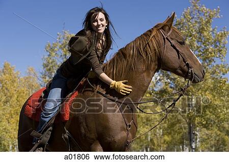 Stock Photograph - woman on a horse. Fotosearch