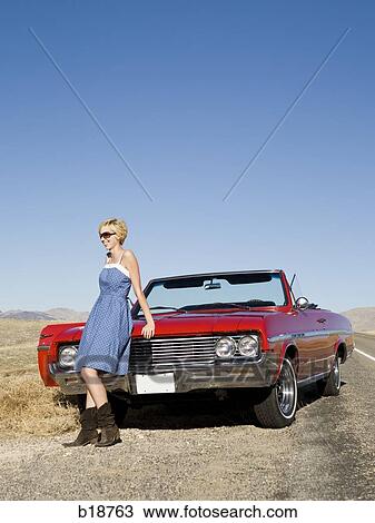 woman on the hood of a red convertible. View Large Photo Image Stock Image - woman on the hood of a red convertible.. Fotosearch