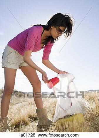 woman picking up trash View Large Photo Image Stock Photo - woman picking up trash. Fotosearch