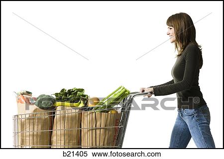 woman pushing a shopping cart View Large Photo Image Stock Photography - woman pushing a shopping cart. Fotosearch