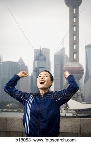 Woman raising arms in the air. View Large Photo Image Stock Image - Woman raising arms in the air.. Fotosearch
