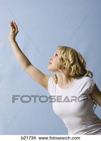 woman reaching up View Large Photo Image Picture - woman reaching up. Fotosearch