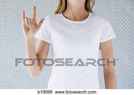 Stock Photo - "Woman signing ""I love you"". ". Fotosearch