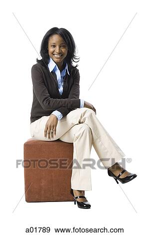 woman sitting on a box View Large Photo Image Stock Photo - woman sitting on a box. Fotosearch