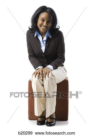 woman sitting on a box View Large Photo Image Stock Photo - woman sitting on a box. Fotosearch