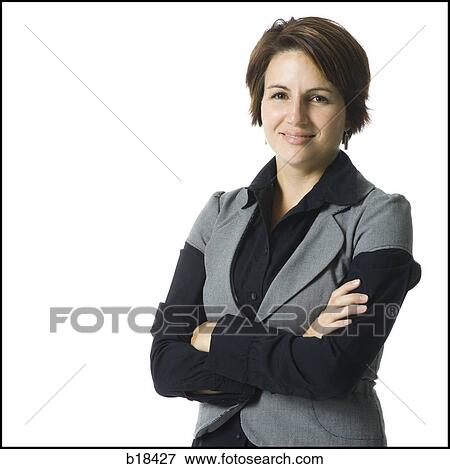 Stock Photo - Woman standing with arms folded.. Fotosearch