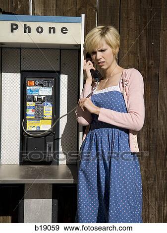 woman using a pay phone. View Large Photo Image Stock Photo - woman using a pay phone.. Fotosearch