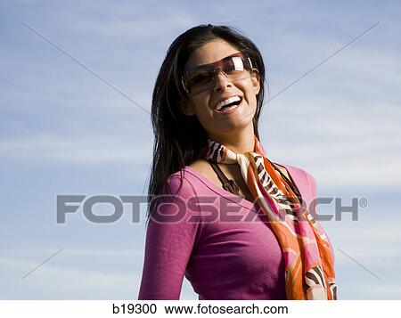 woman wearing sunglasses View Large Photo Image Stock Image - woman wearing sunglasses. Fotosearch