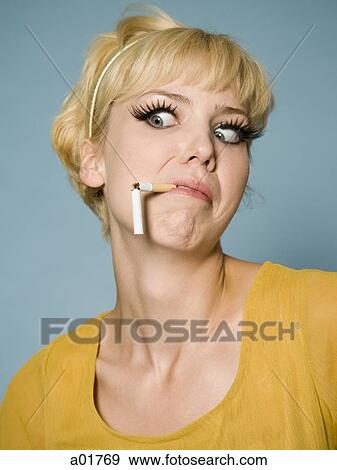 woman with a broken cigarette in her mouth View Large Photo Image Stock Photo - woman with a broken cigarette in her mouth. Fotosearch