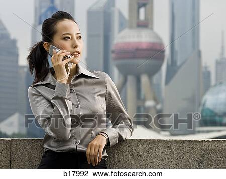 Woman with a cell phone. View Large Photo Image Stock Image - Woman with a cell phone.. Fotosearch