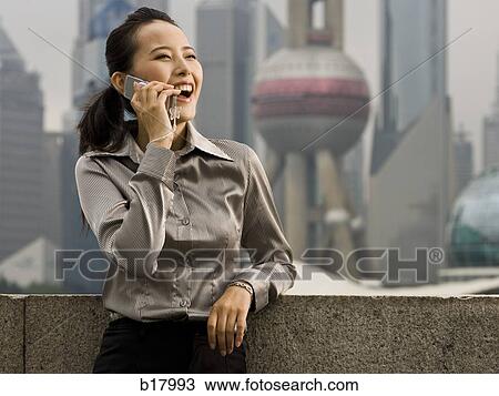 Woman with a cell phone. View Large Photo Image Stock Image - Woman with a cell phone.. Fotosearch