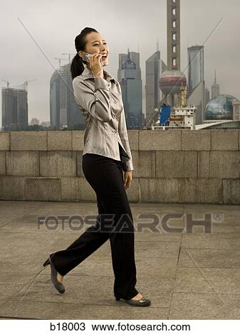 Woman with a cell phone. View Large Photo Image Stock Image - Woman with a cell phone.. Fotosearch