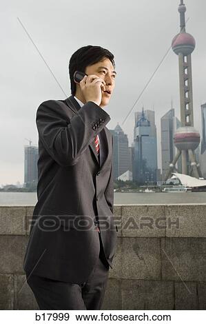 Stock Photo - Woman with a cell phone.. Fotosearch