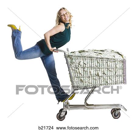 woman with a shopping cart full of money View Large Photo Image Picture - woman with a shopping cart full of money. Fotosearch