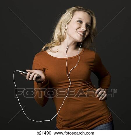 woman with an mp3 player View Large Photo Image Stock Image - woman with an mp3 player. Fotosearch