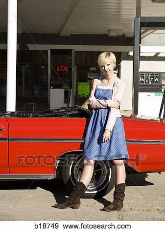 woman with cowboy boots at a gas station. View Large Photo Image Stock Photo - woman with cowboy boots at a gas station.. Fotosearch