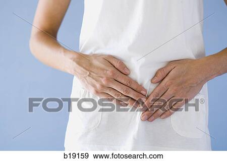 woman with hands on stomach. View Large Photo Image Stock Photo - woman with hands on stomach.. Fotosearch