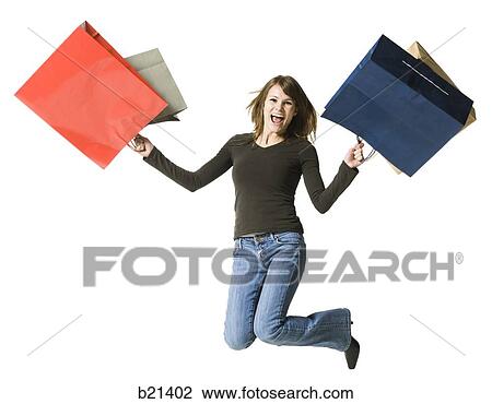 Stock Image - woman with shopping bags. Fotosearch