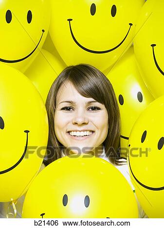woman with smiley face balloons View Large Photo Image Stock Photograph - woman with smiley face balloons. Fotosearch