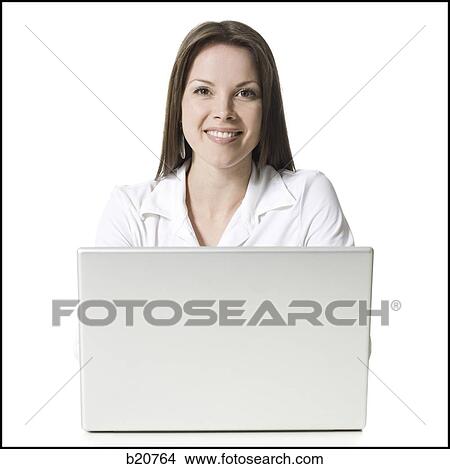 woman working on a laptop View Large Photo Image Picture - woman working on a laptop. Fotosearch