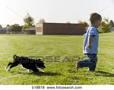 Young boy and a puppy. View Large Photo Image Stock Photo - Young boy and a puppy.. Fotosearch