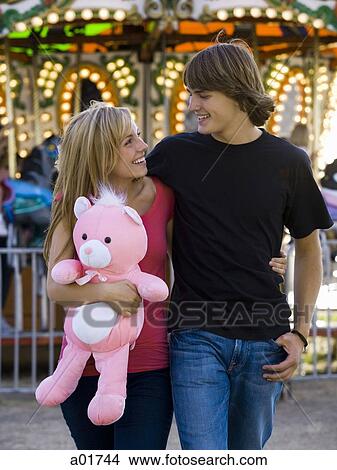 young couple at an amusement park View Large Photo Image Picture - young couple at an amusement park. Fotosearch
