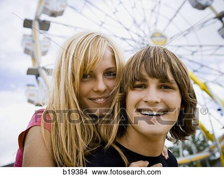 young couple at an amusement park View Large Photo Image Picture - young couple at an amusement park. Fotosearch