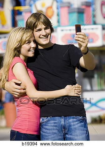 young couple at an amusement park View Large Photo Image Picture - young couple at an amusement park. Fotosearch