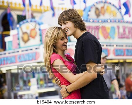 young couple at an amusement park View Large Photo Image Picture - young couple at an amusement park. Fotosearch