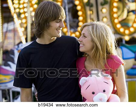 young couple at an amusement park View Large Photo Image Picture - young couple at an amusement park. Fotosearch