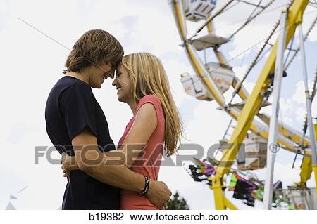 young couple at an amusement park View Large Photo Image Stock Image - young couple at an amusement park. Fotosearch