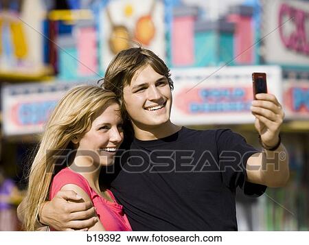 young couple at an amusement park View Large Photo Image Stock Image - young couple at an amusement park. Fotosearch