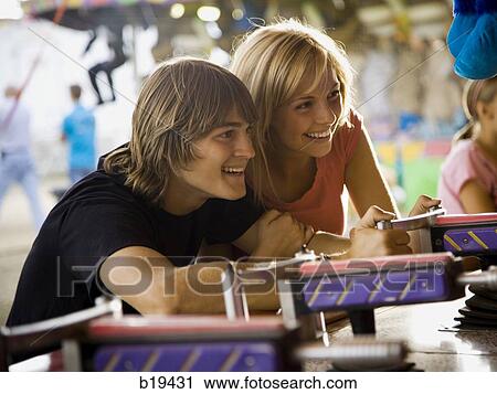 young couple at an amusement park View Large Photo Image Stock Image - young couple at an amusement park. Fotosearch