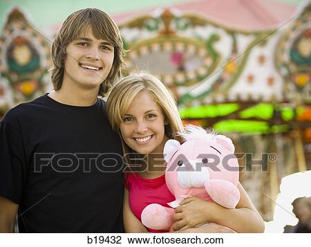 young couple at an amusement park View Large Photo Image Stock Image - young couple at an amusement park. Fotosearch