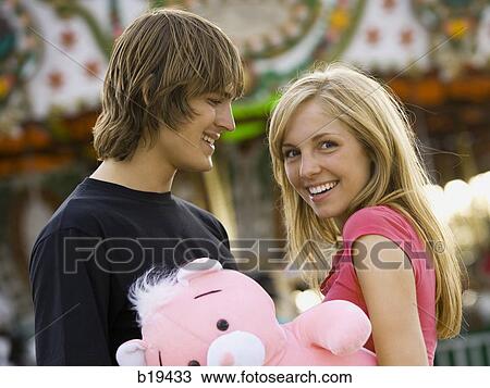 young couple at an amusement park View Large Photo Image Stock Image - young couple at an amusement park. Fotosearch