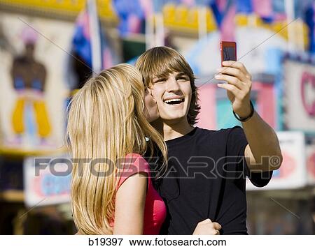 young couple at an amusement park View Large Photo Image Stock Photo - young couple at an amusement park. Fotosearch