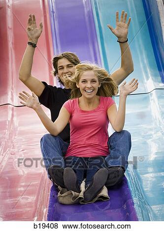 young couple at an amusement park View Large Photo Image Stock Photo - young couple at an amusement park. Fotosearch