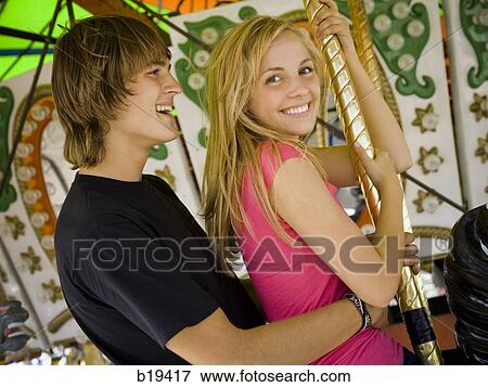 young couple at an amusement park View Large Photo Image Stock Photo - young couple at an amusement park. Fotosearch