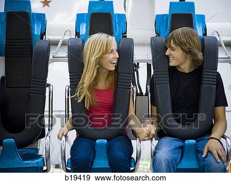 young couple at an amusement park View Large Photo Image Stock Photo - young couple at an amusement park. Fotosearch
