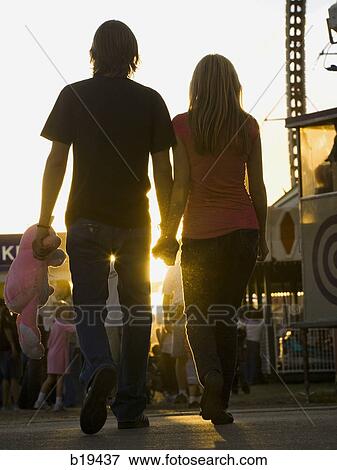 young couple at an amusement park View Large Photo Image Stock Photo - young couple at an amusement park. Fotosearch