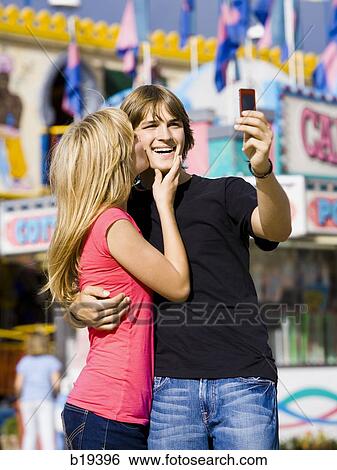 young couple at an amusement park View Large Photo Image Stock Photograph - young couple at an amusement park. Fotosearch